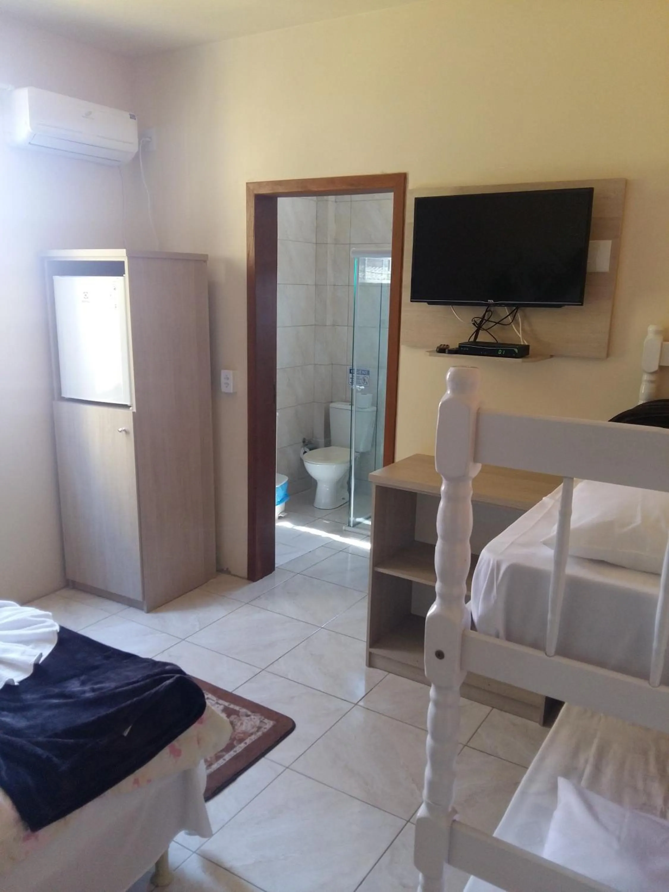 Communal lounge/ TV room, Bed in Hotel Rochamar