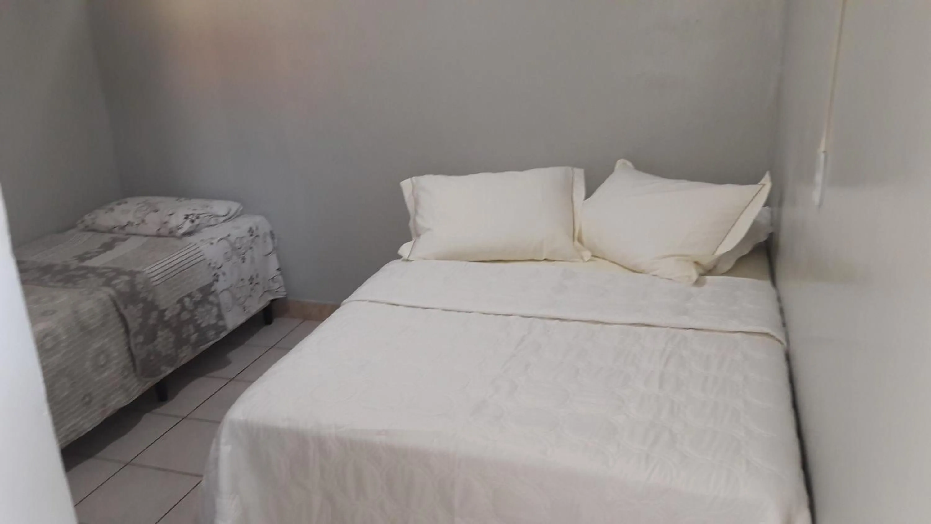 Bed in Pousada Martins e Cia