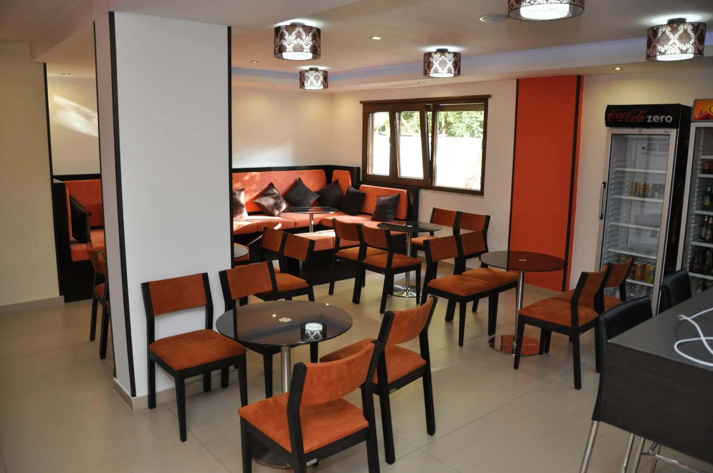 Communal lounge/ TV room in Sunrise Hotel Cameria