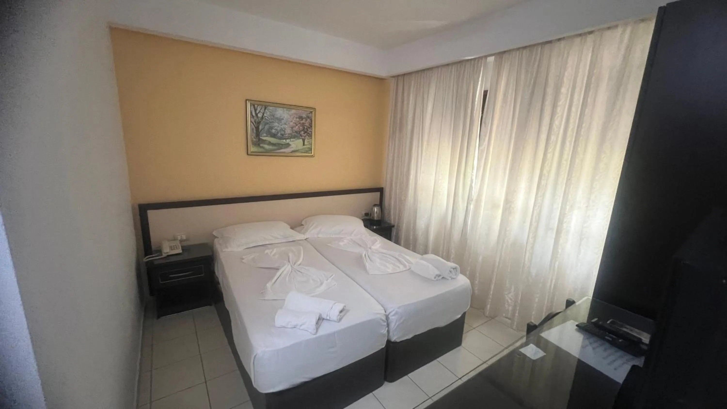 Bed in Sunrise Hotel Cameria