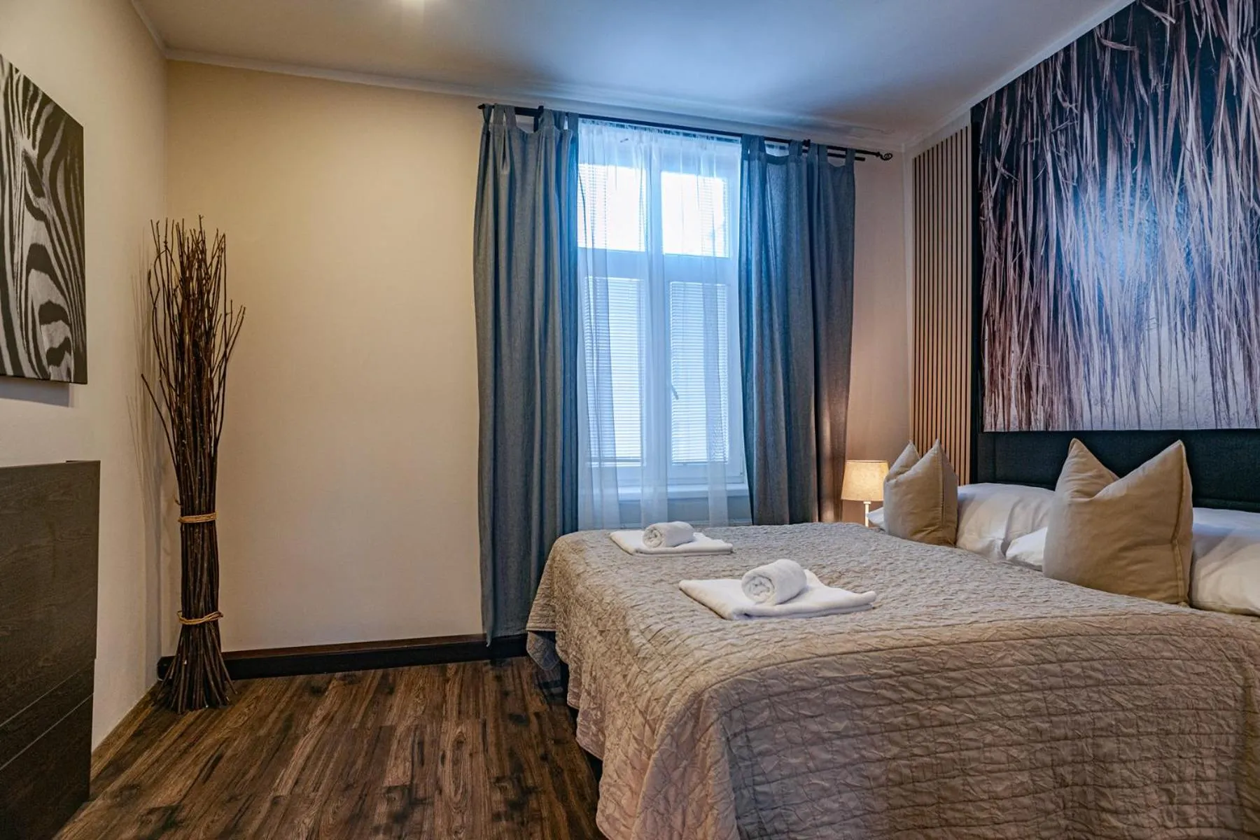 Bed in STING Boutique Apartments