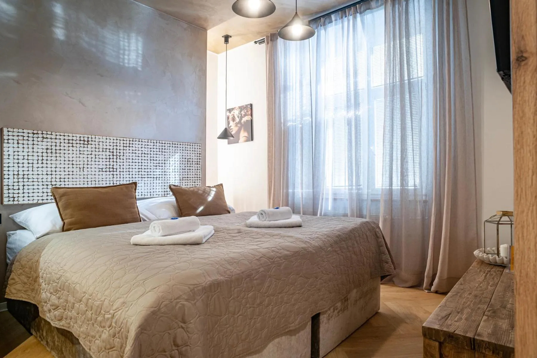 Bed in STING Boutique Apartments