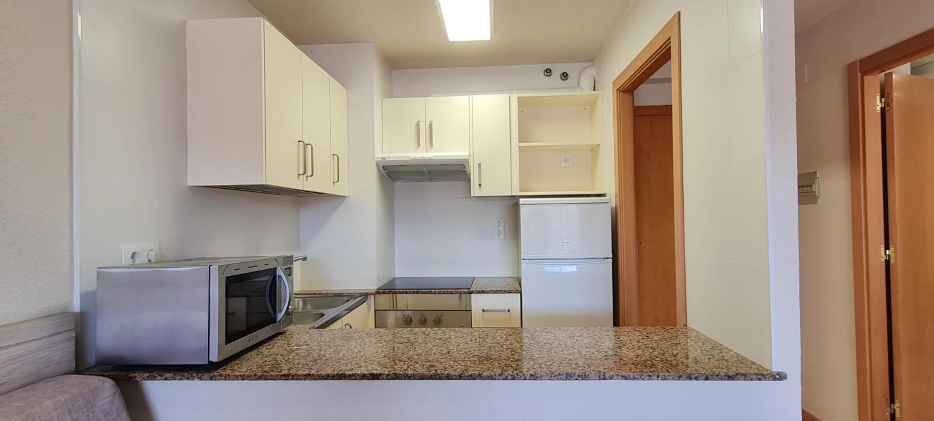 Kitchen or kitchenette in Apartamentos Turísticos Augustus