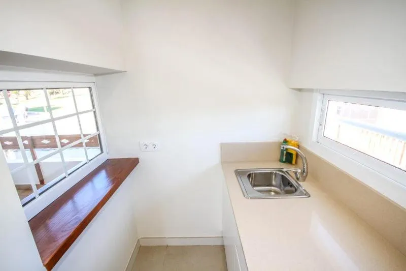 Kitchen or kitchenette in New Miami Playa Apartamentos