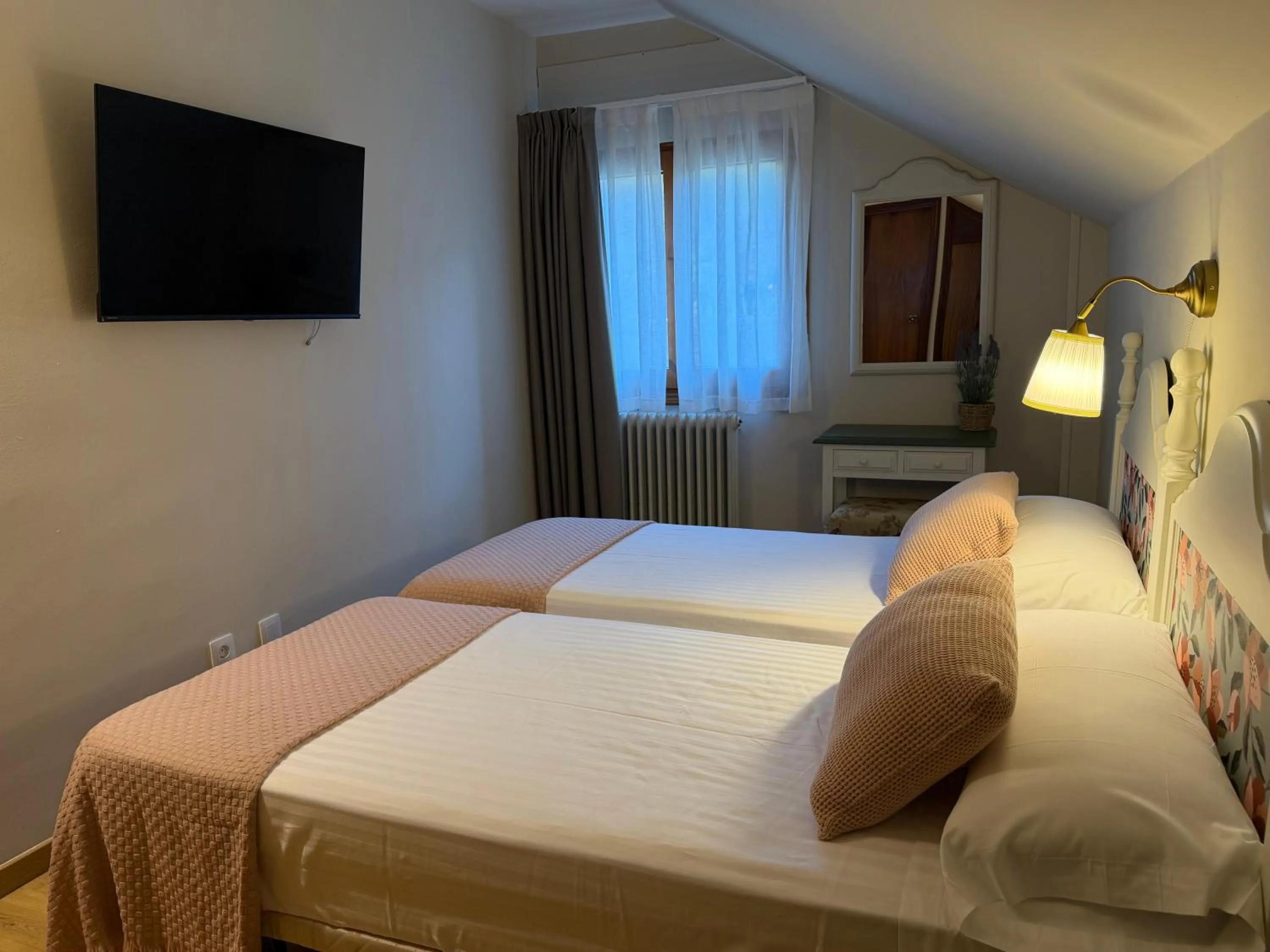 Bed in Edelweiss Hotel