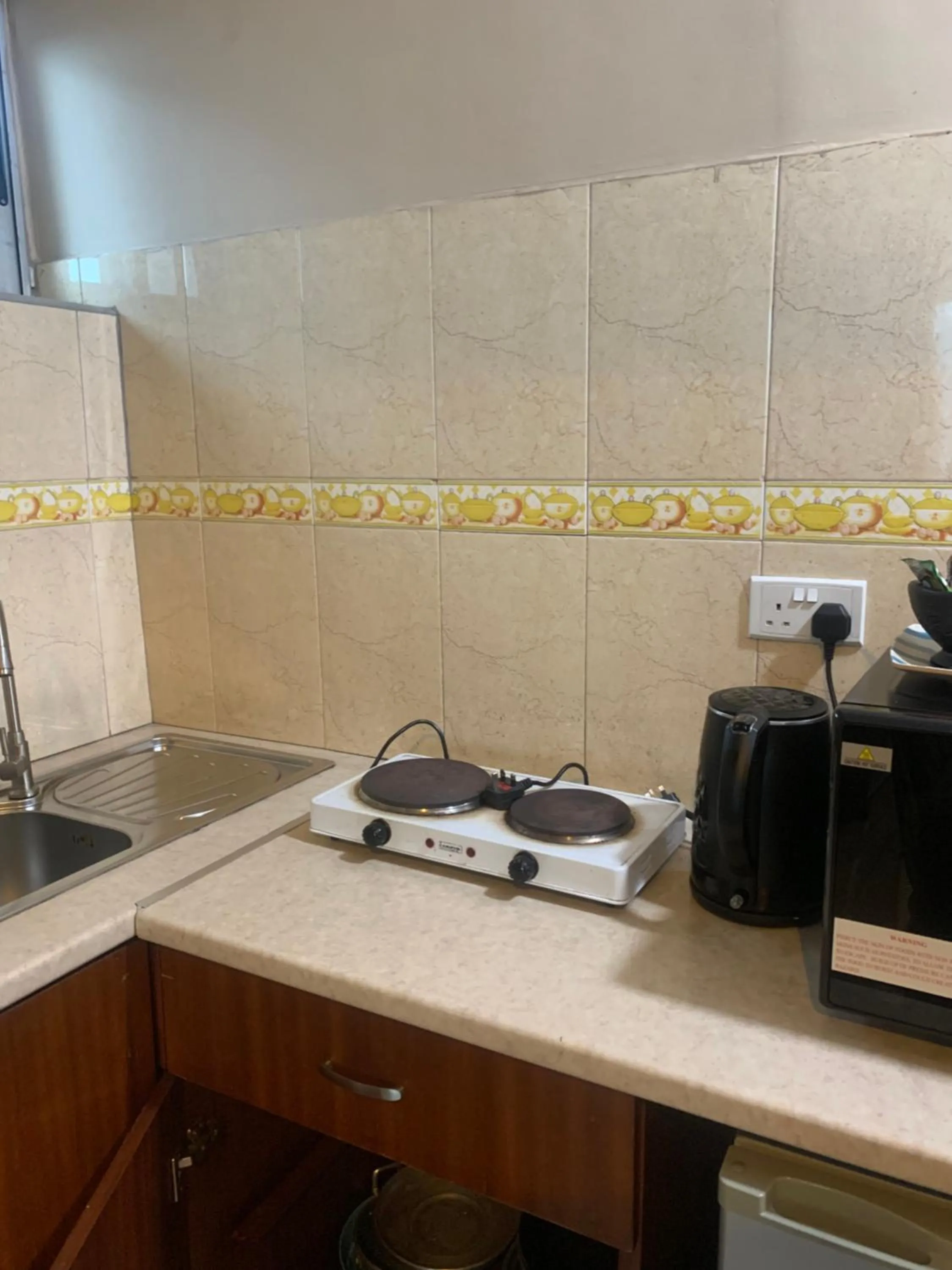 Kitchen or kitchenette in Manjaro Suites