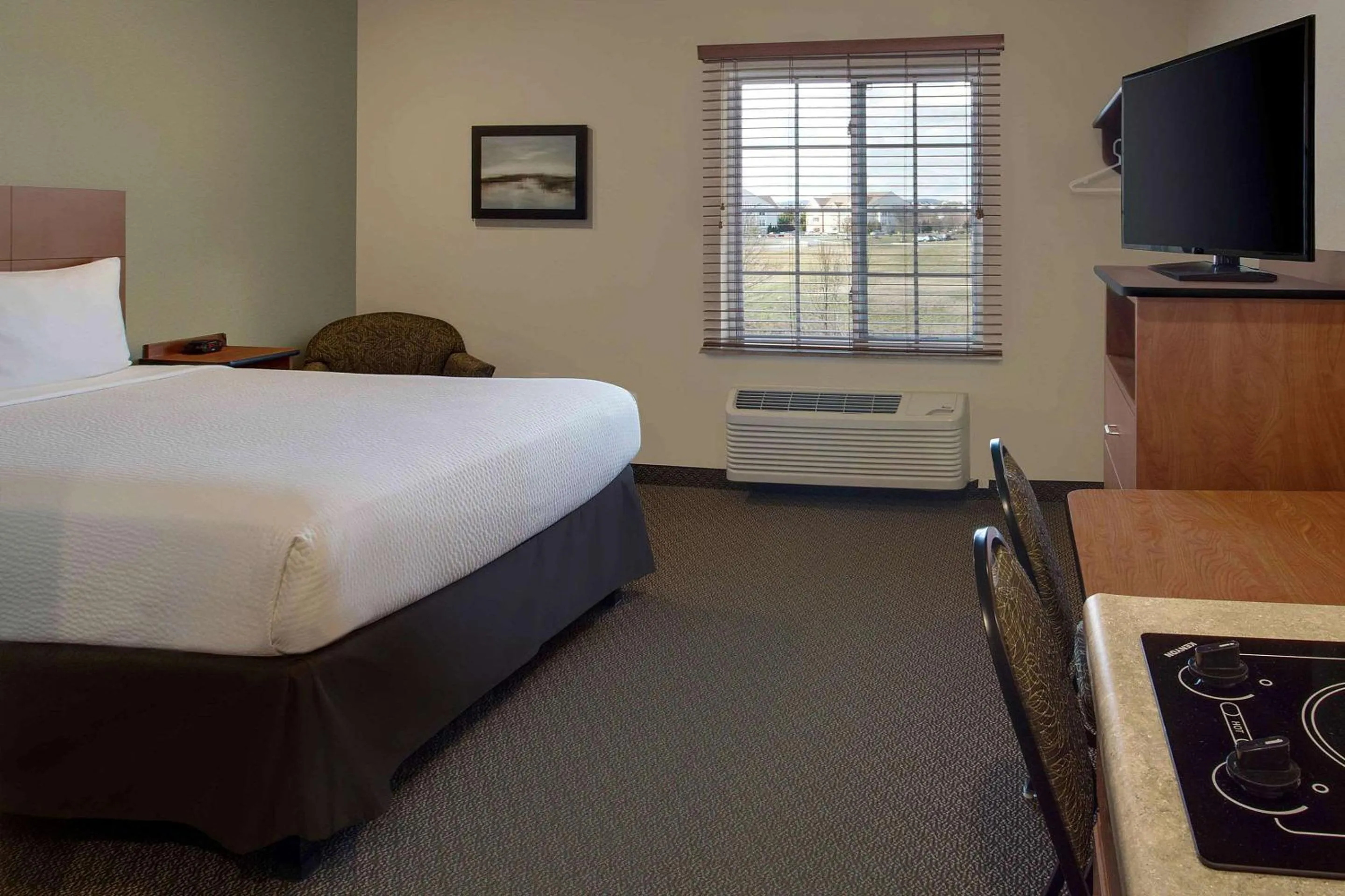 Photo of the whole room, Bed in WoodSpring Suites Frederick I-70