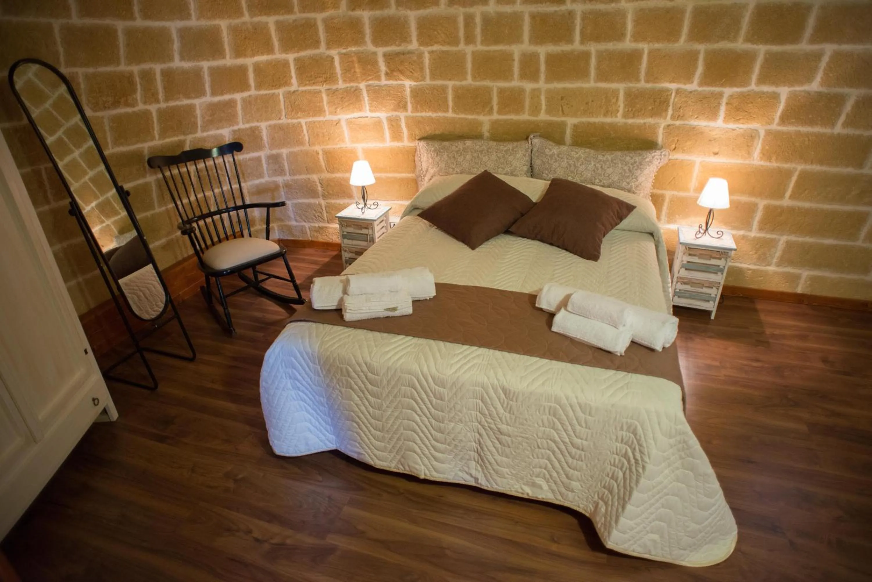 Bed in Grandi Trulli Bed & Breakfast