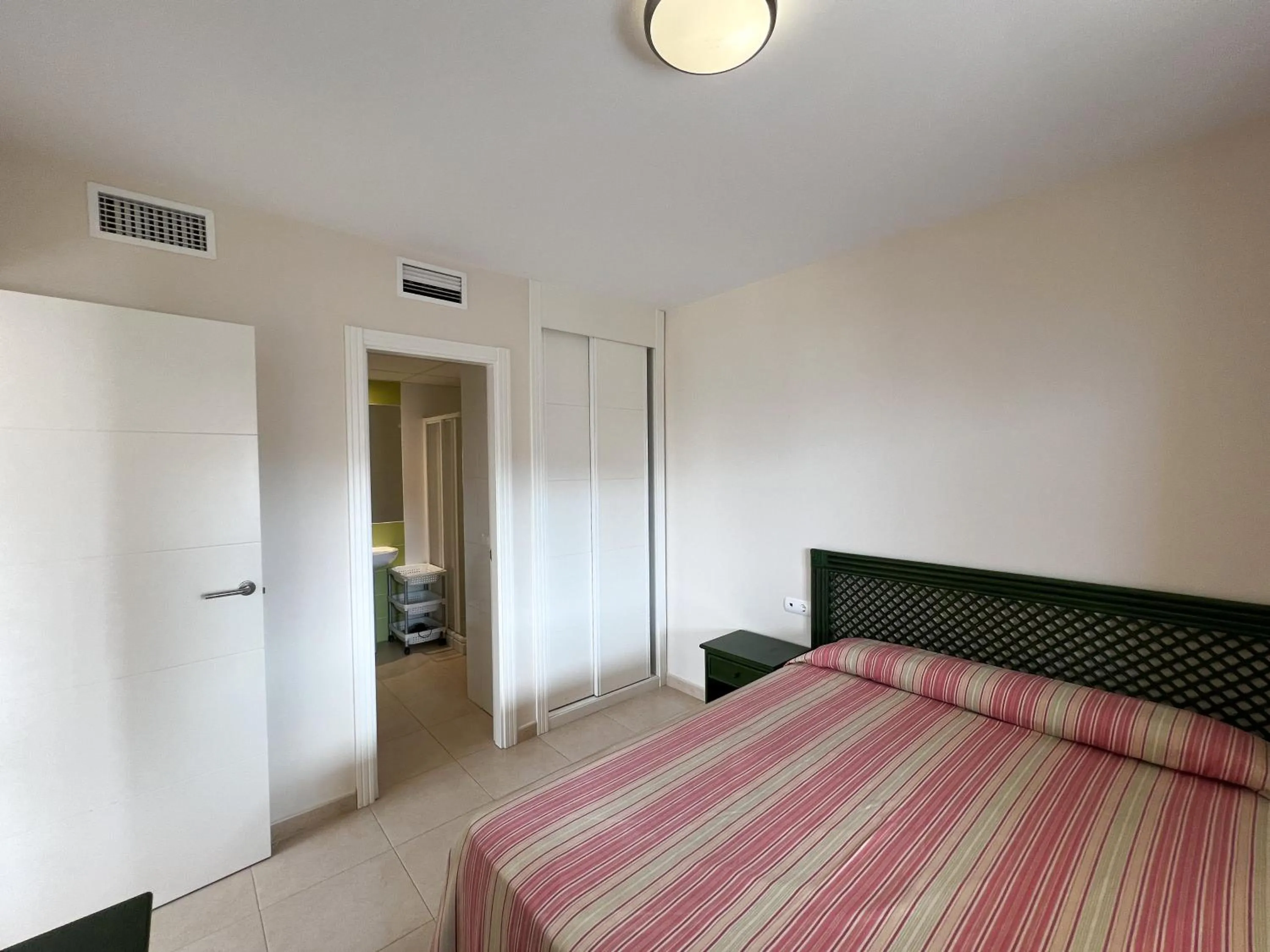 Bed in Apartamentos Larimar Unitursa