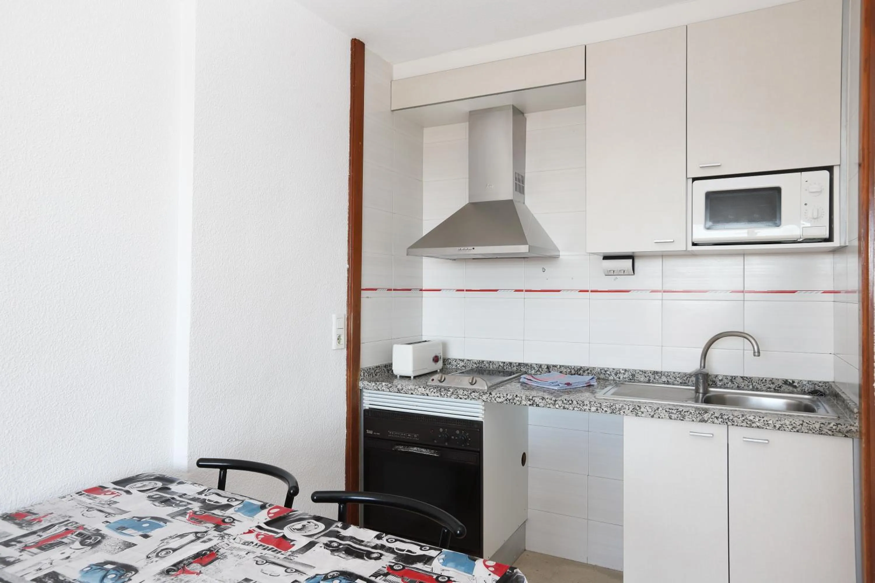 Kitchen or kitchenette in La Caseta Apartments