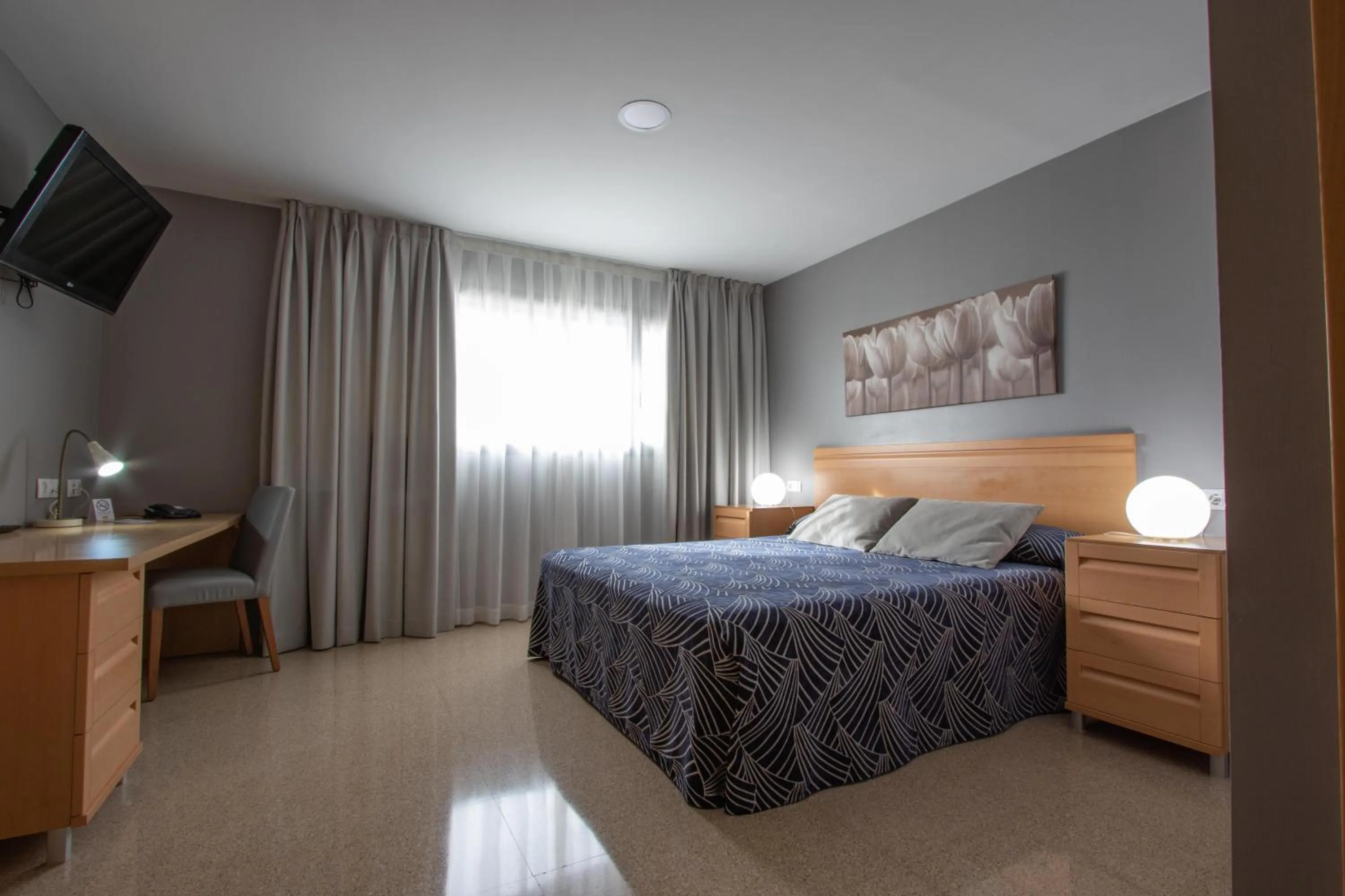 Seating area, Bed in Villa Alojamiento y Congresos - Villa Universitaria