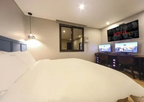 Bed in The Stone Bridge Hotel Sasang