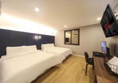 Bed in The Stone Bridge Hotel Sasang