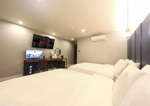 Bed in The Stone Bridge Hotel Sasang