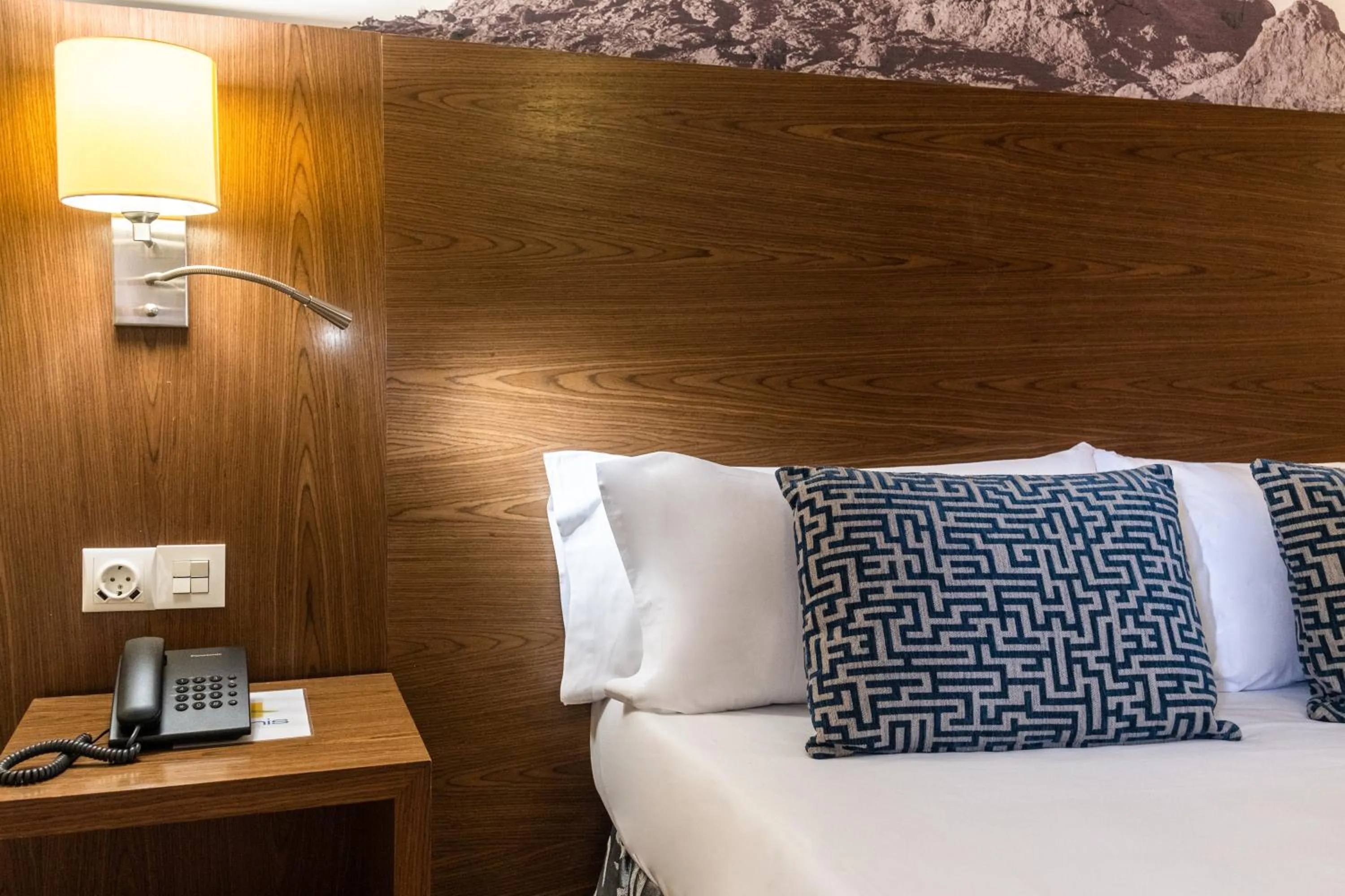 Bed in Hotel Adonis Plaza