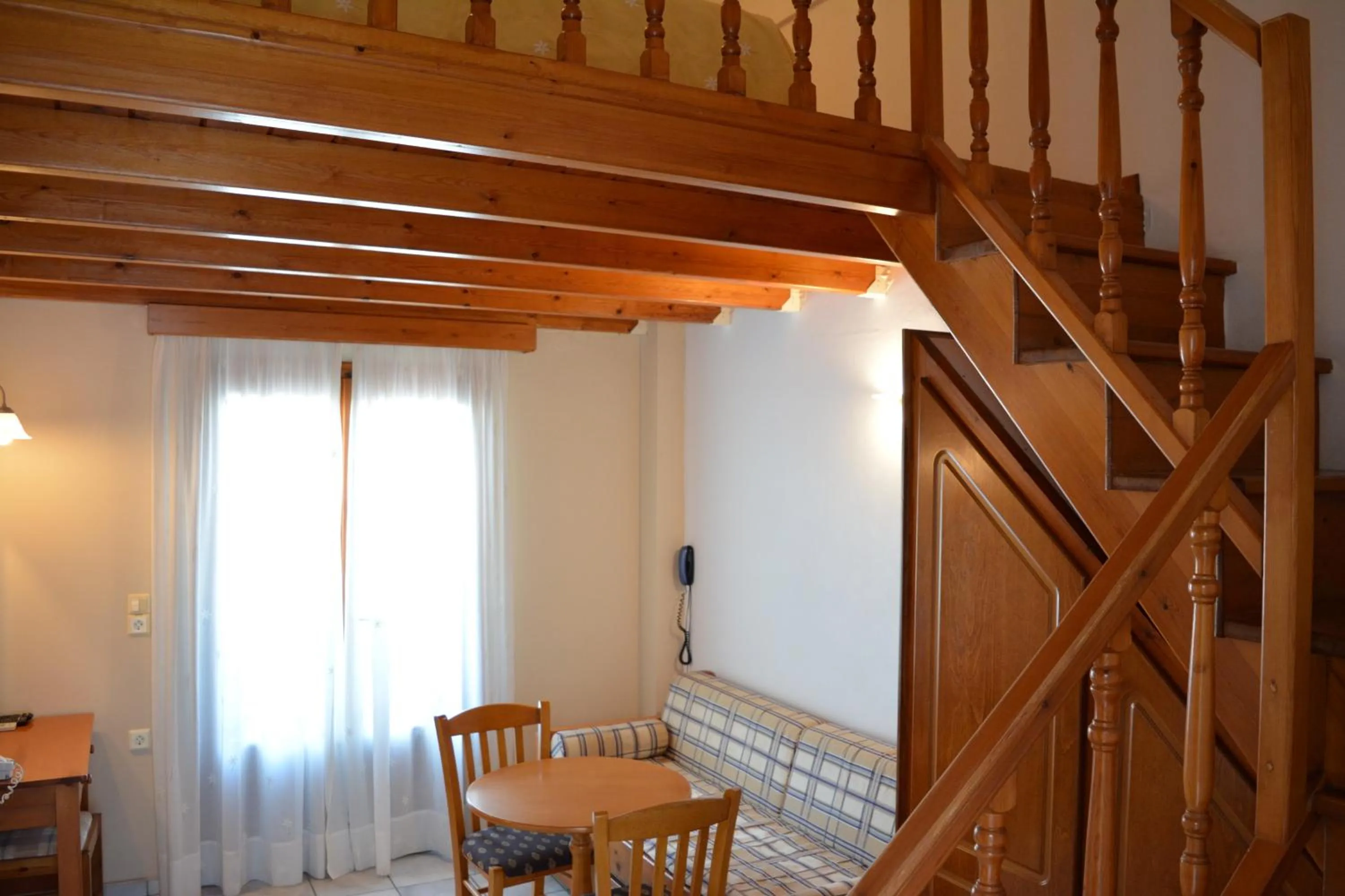 Bed in Anemomilos Suites