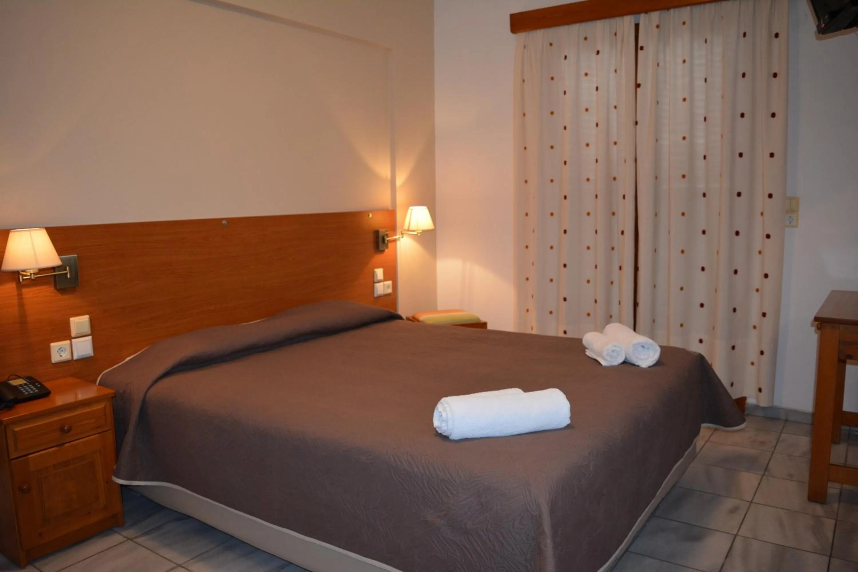 Bed in Anemomilos Suites