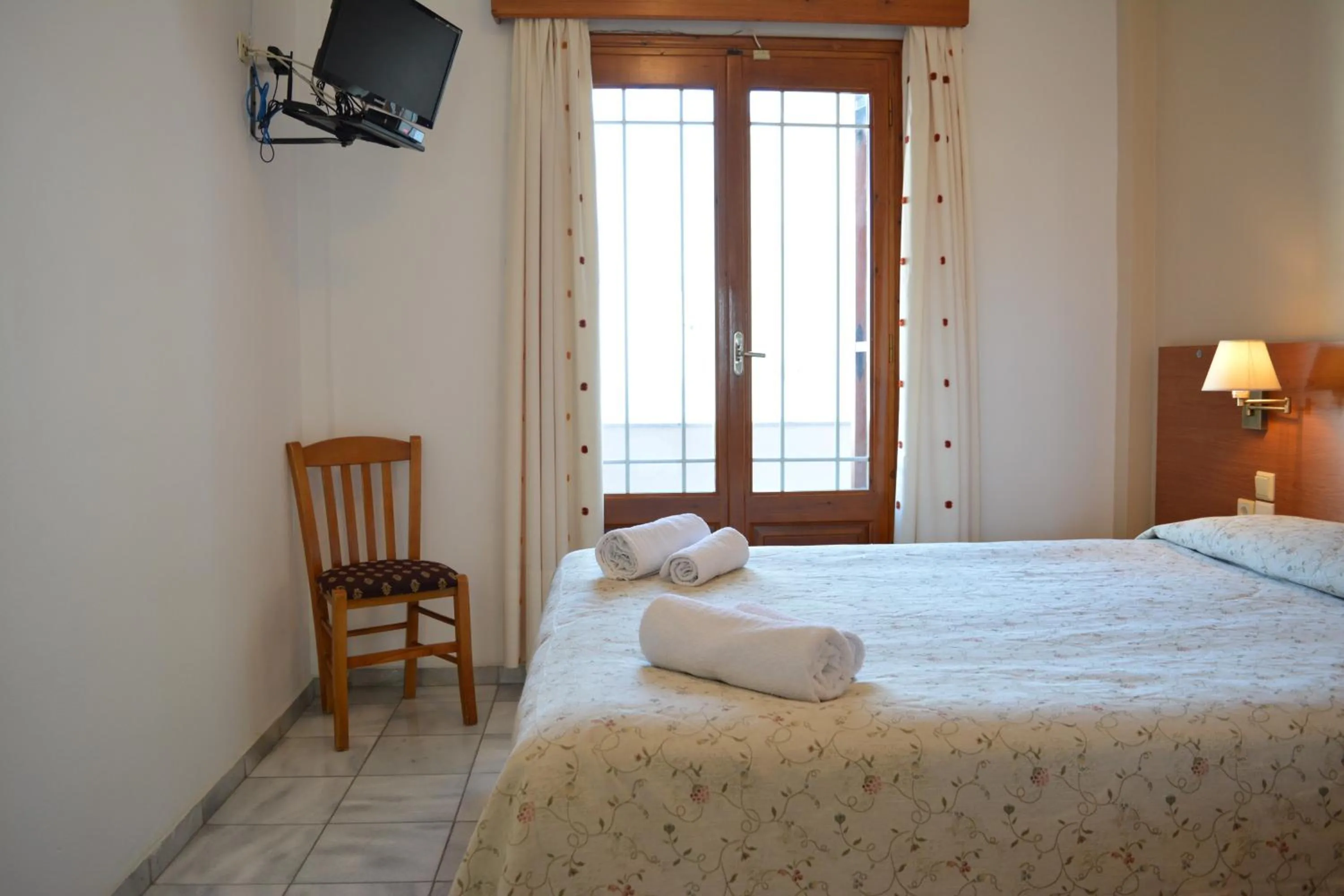 Bed in Anemomilos Suites