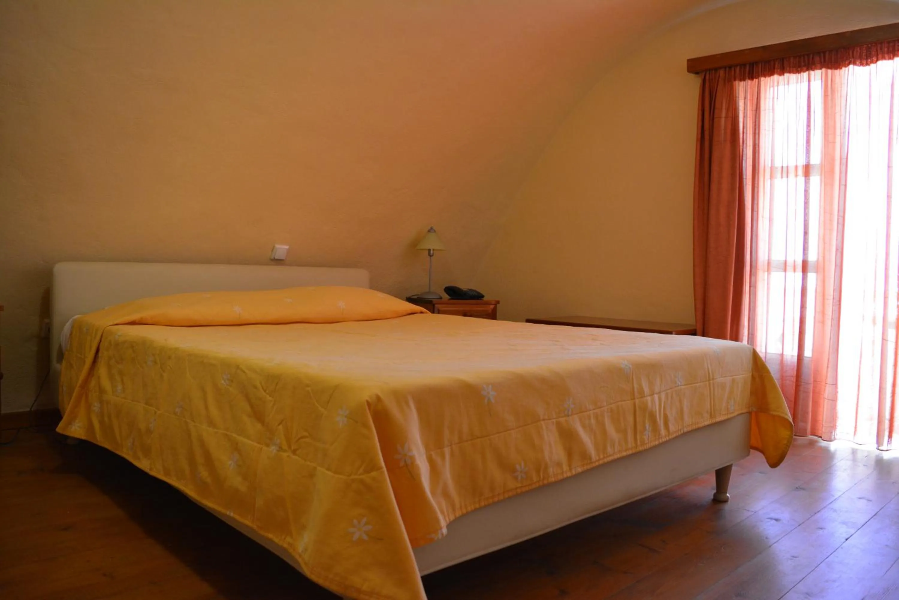 Bed in Anemomilos Suites