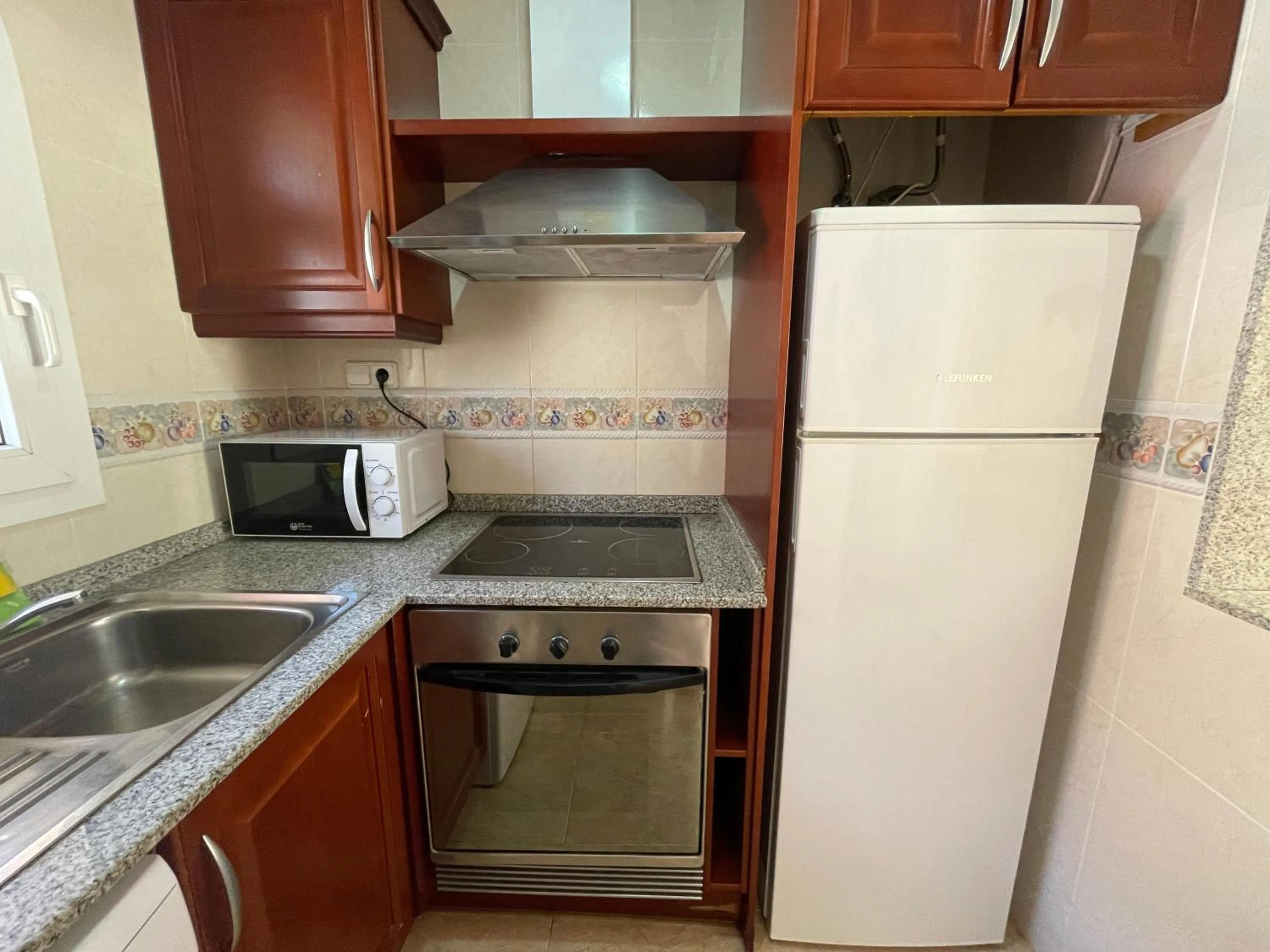 Kitchen or kitchenette in Apartamentos Madeira 3000