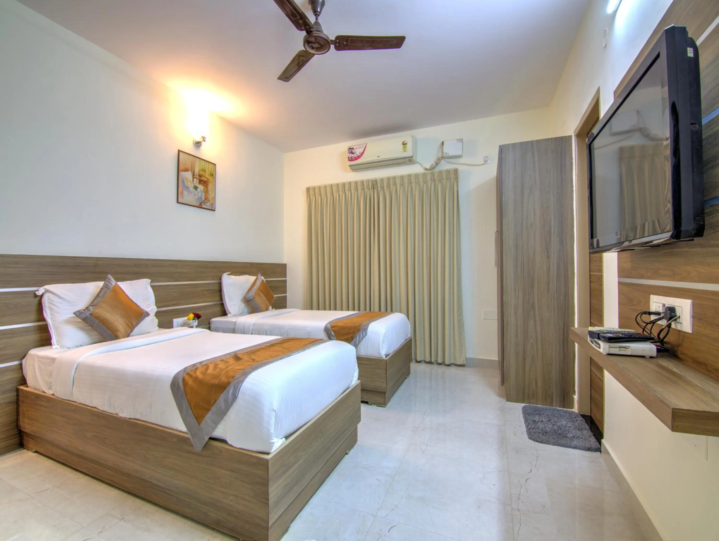 Bed in Sunshine Suites Grand Deluxe