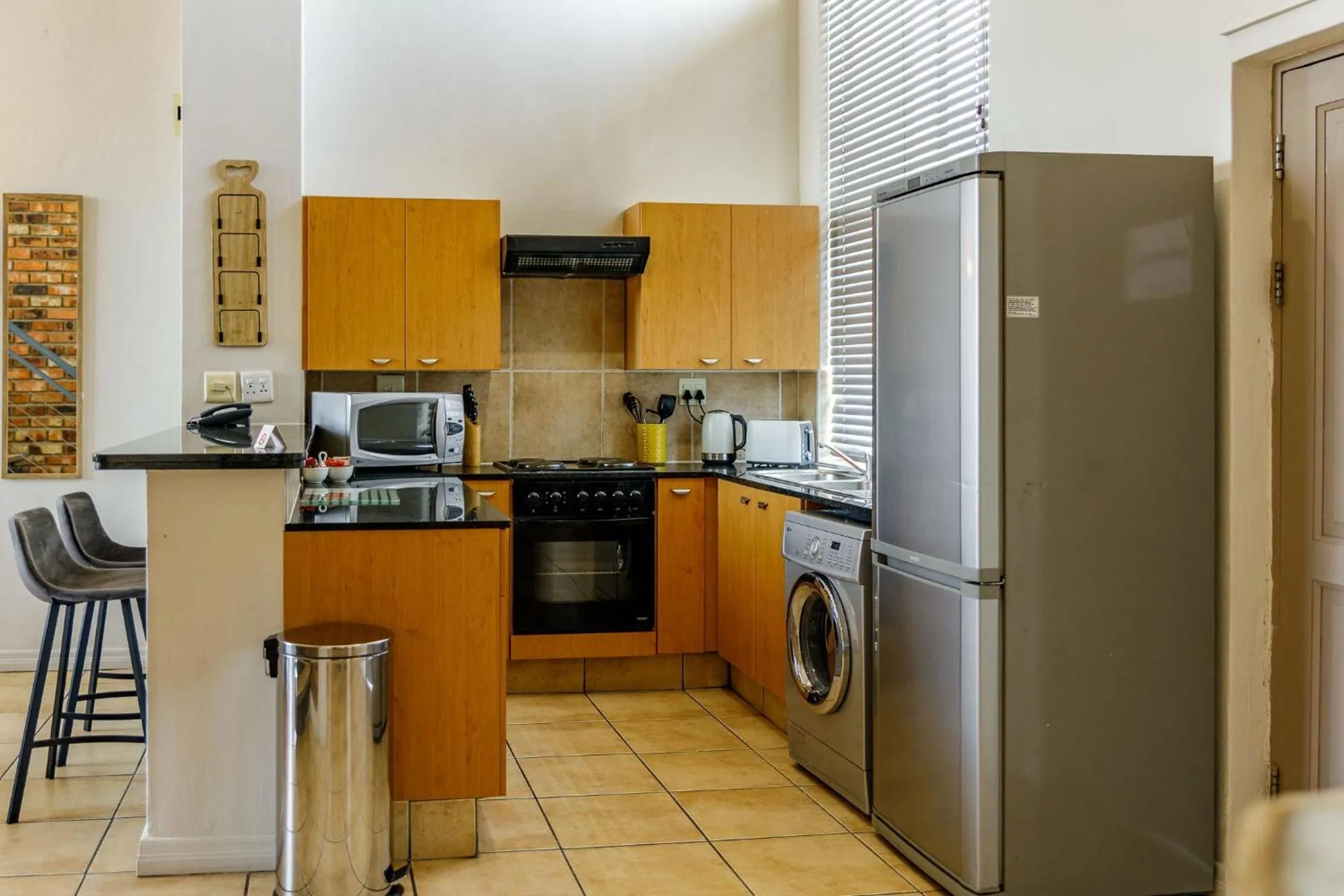 Kitchen or kitchenette in WeStay Westpoint Apartments