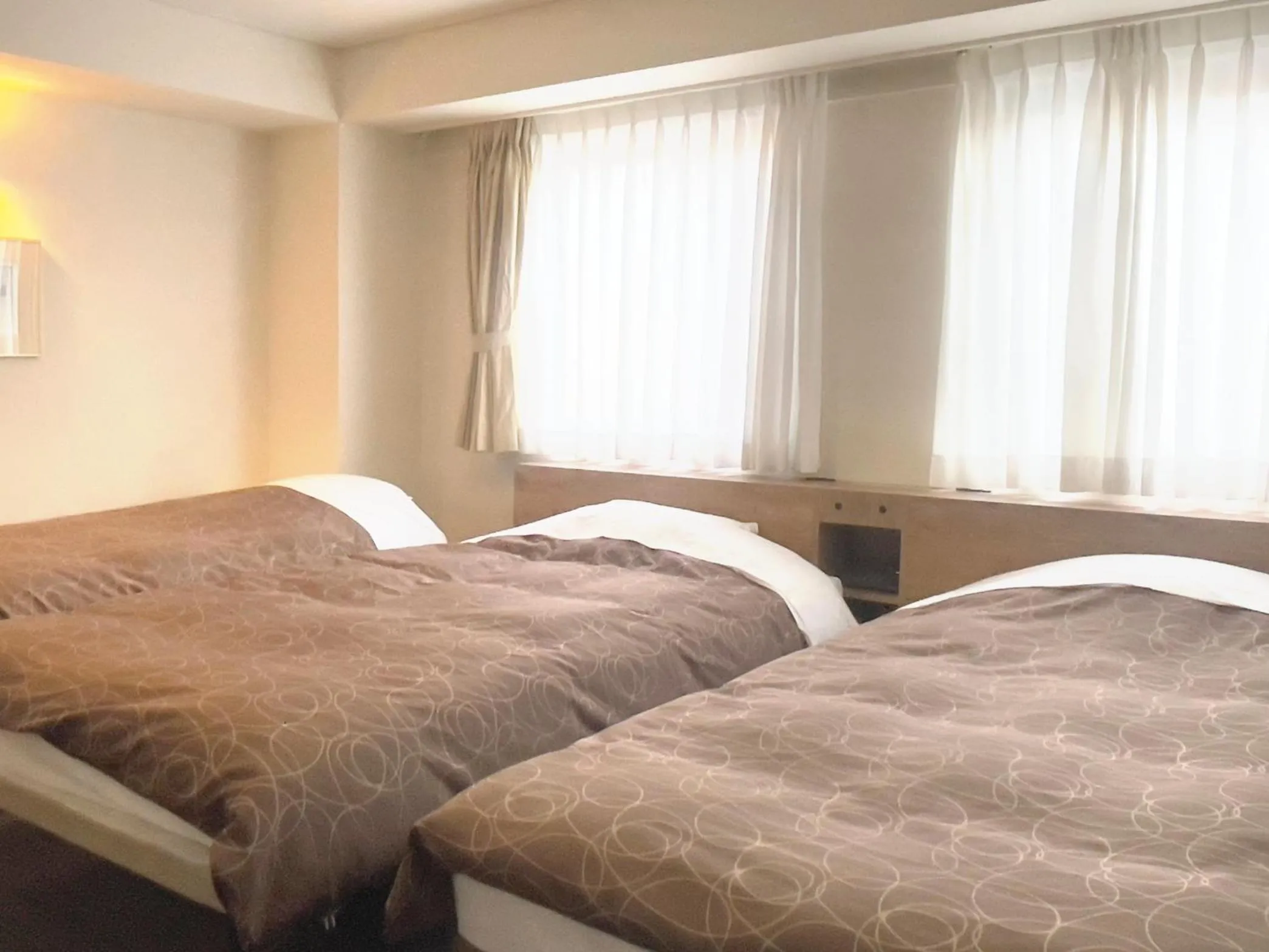 Bed in Ichinomiya Green Hotel