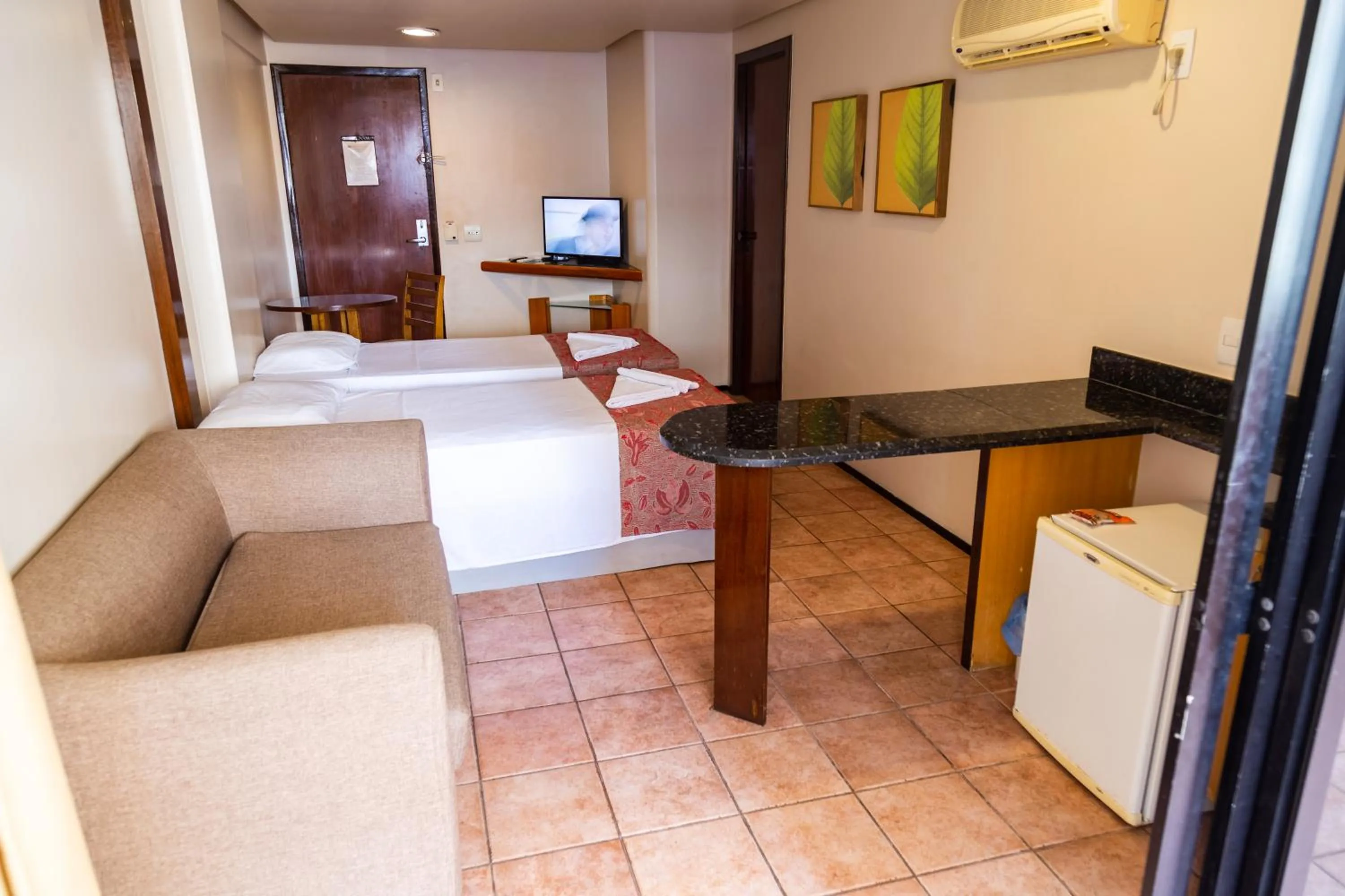 Bed in Plaza Praia Suítes