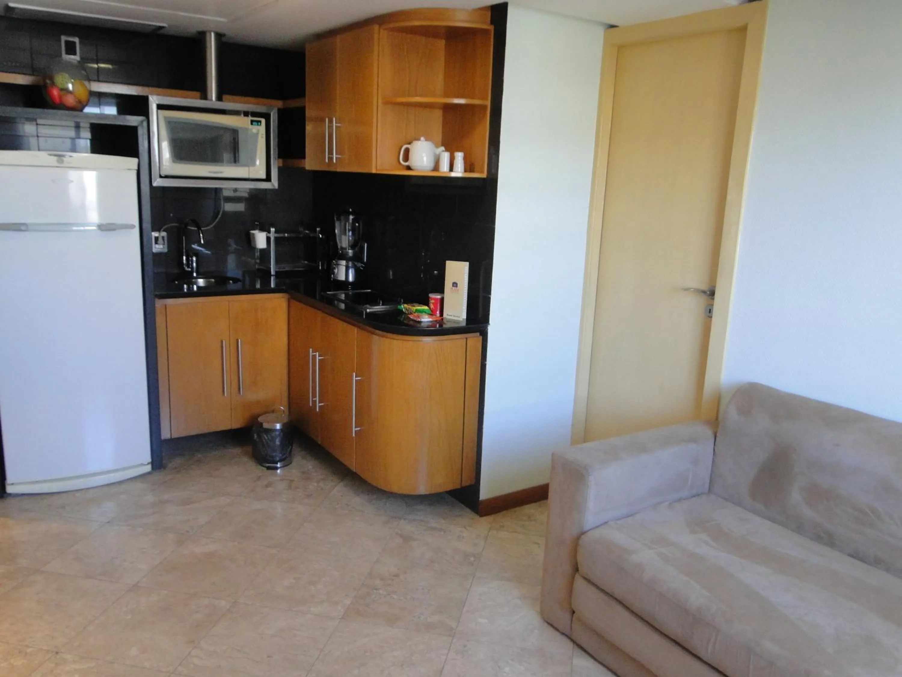 Living room in Plaza Praia Suítes