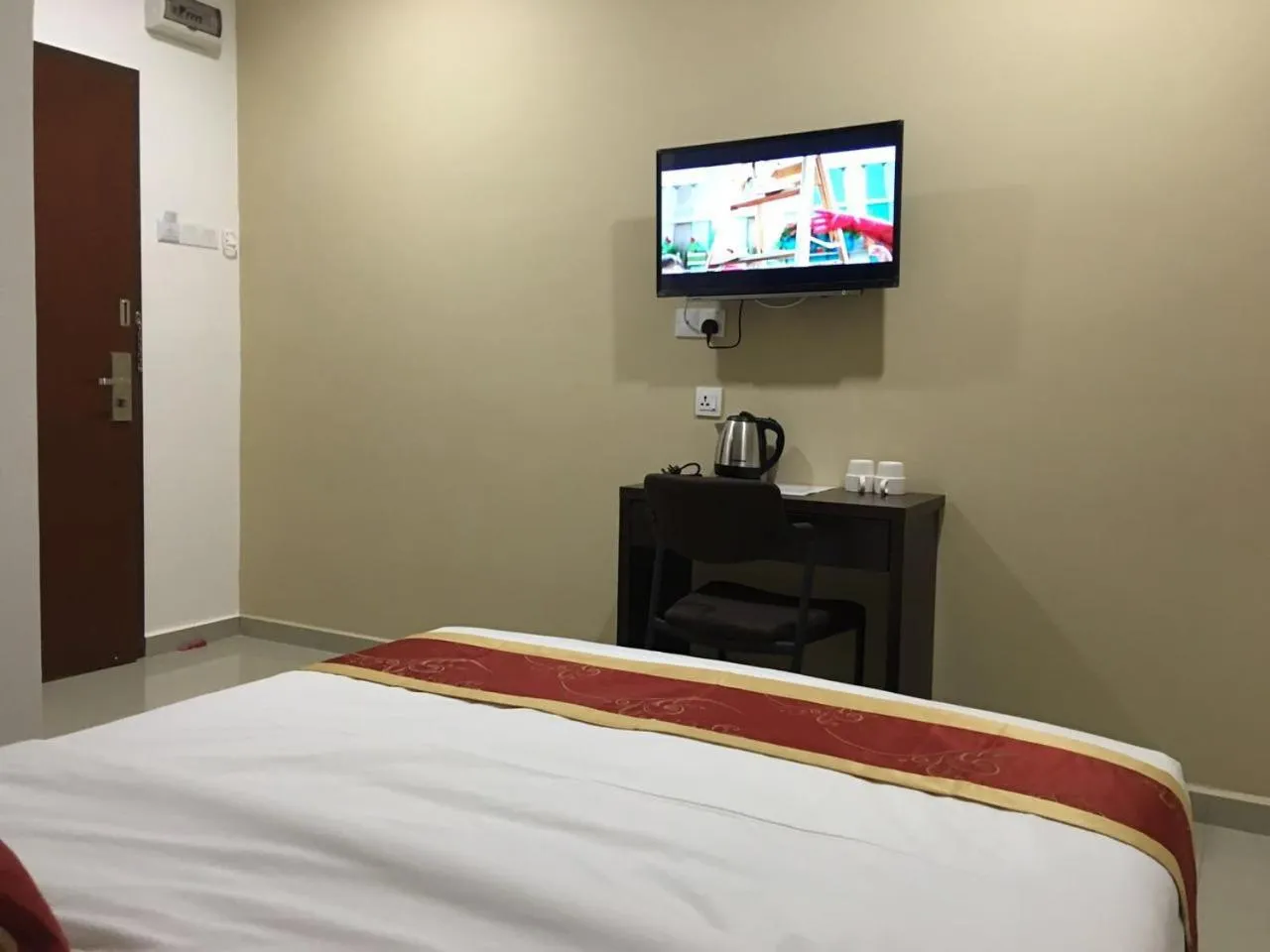 Bed in Global Inn Hotel