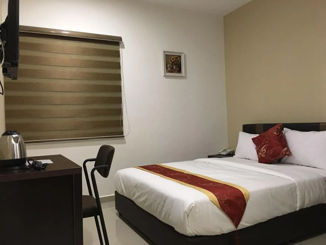 Bed in Global Inn Hotel