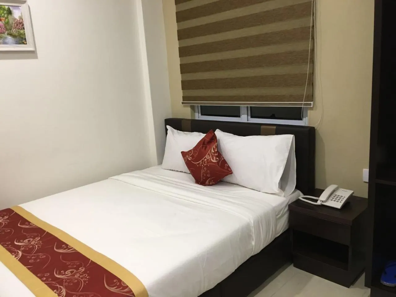 Bed in Global Inn Hotel