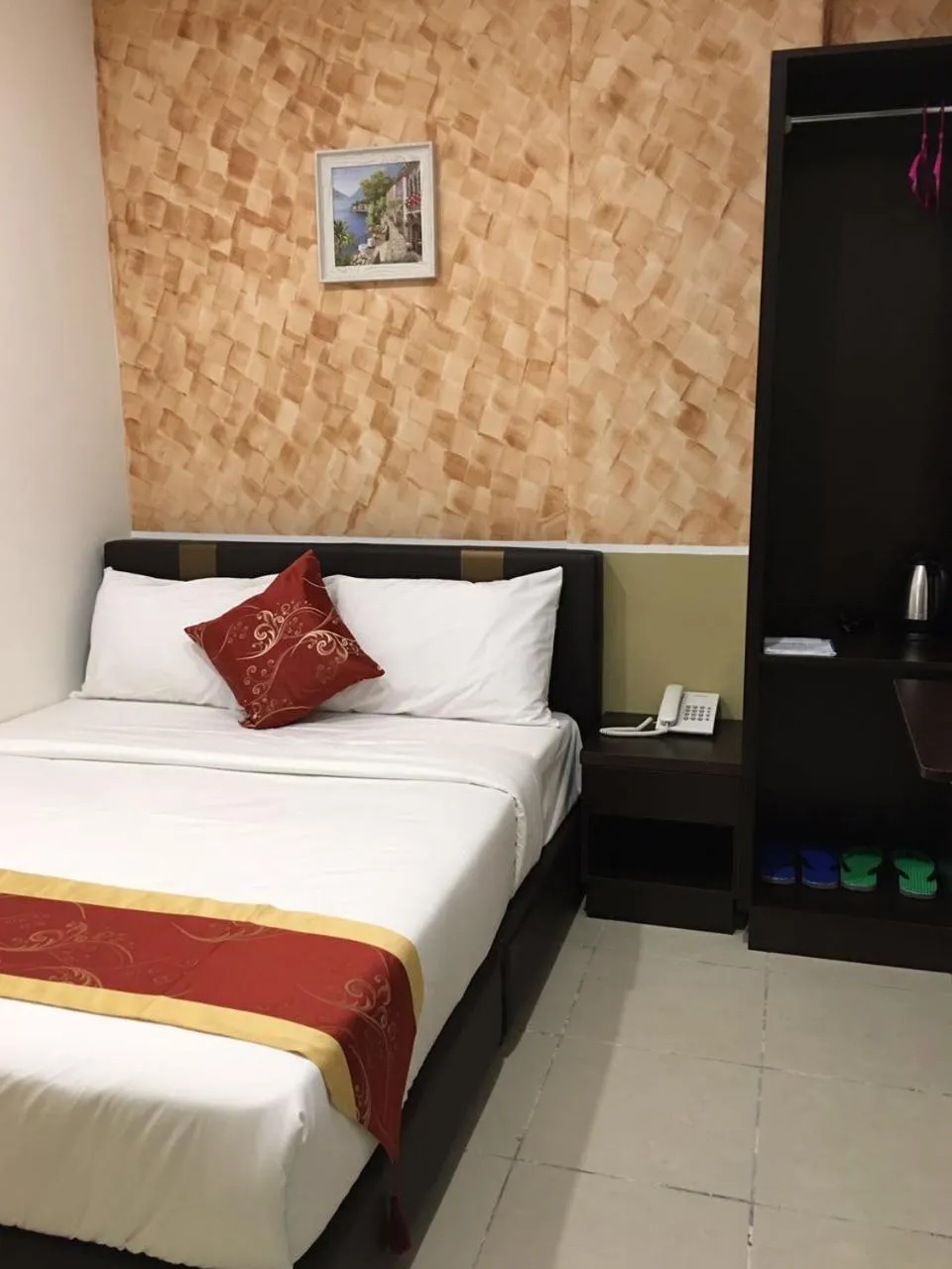 Bed in Global Inn Hotel