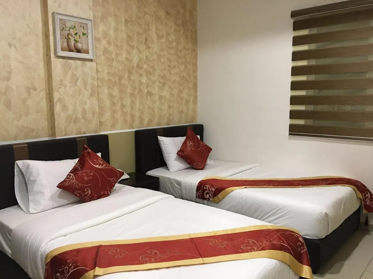 Bed in Global Inn Hotel