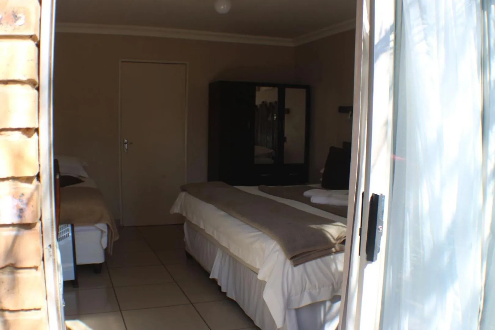 Bed in Ukarimu Guest House