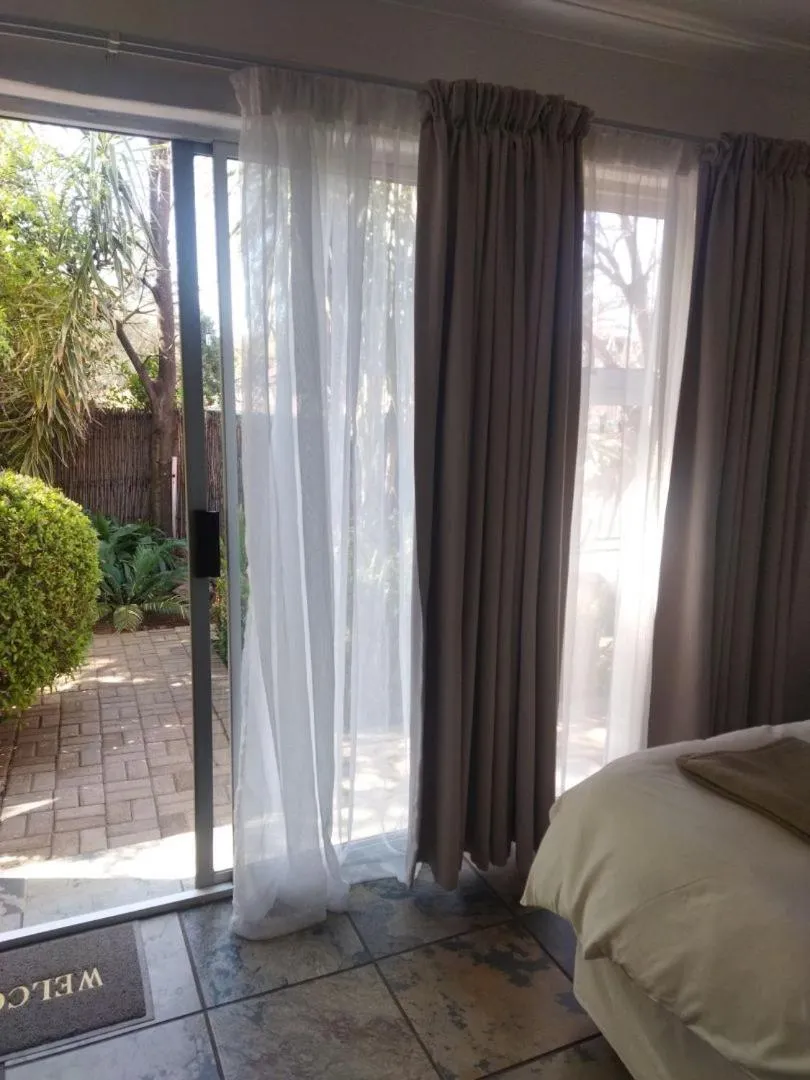 Bed in Ukarimu Guest House