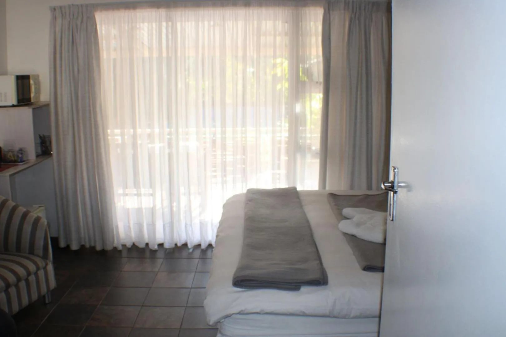 Bed in Ukarimu Guest House