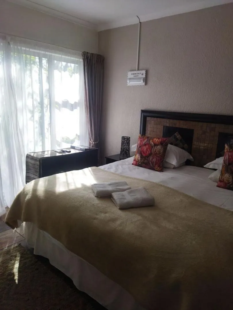 Bed in Ukarimu Guest House