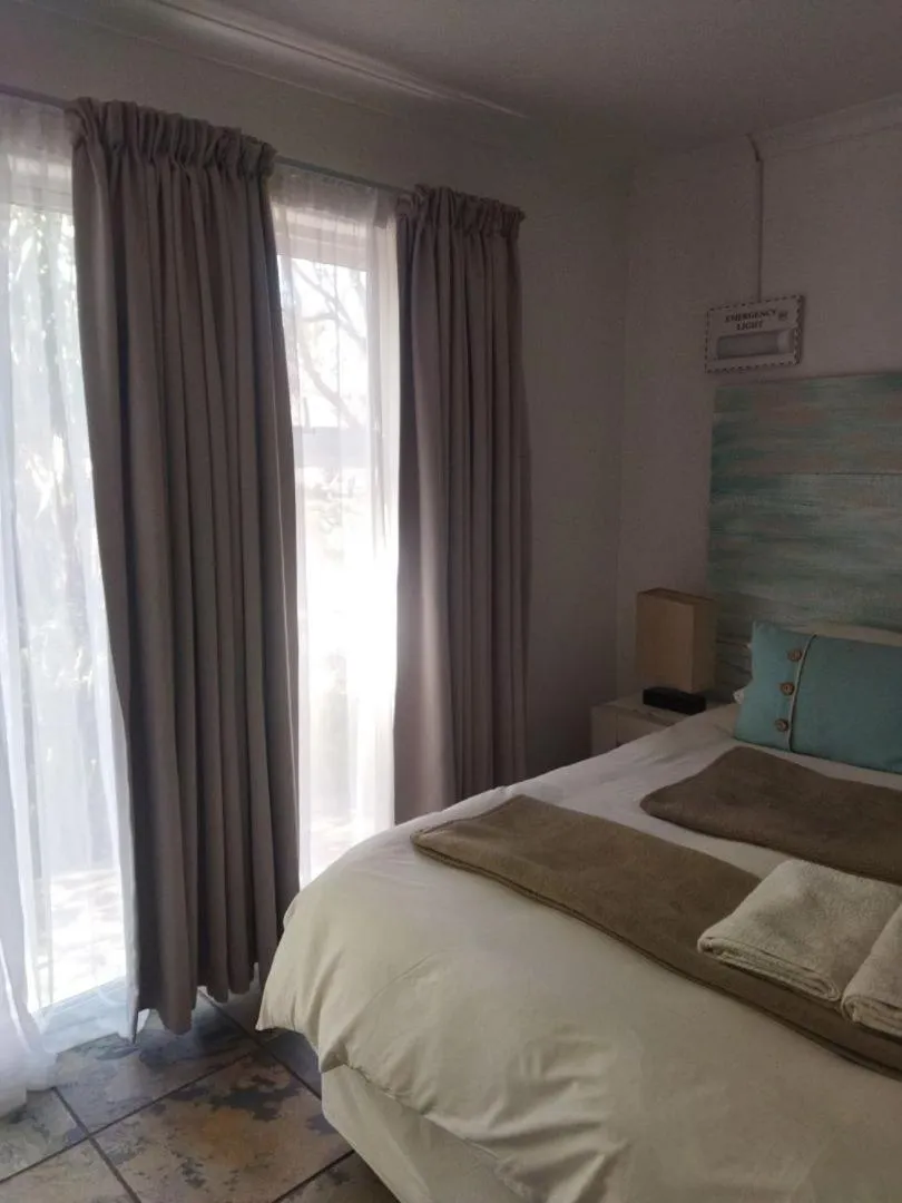 Bed in Ukarimu Guest House