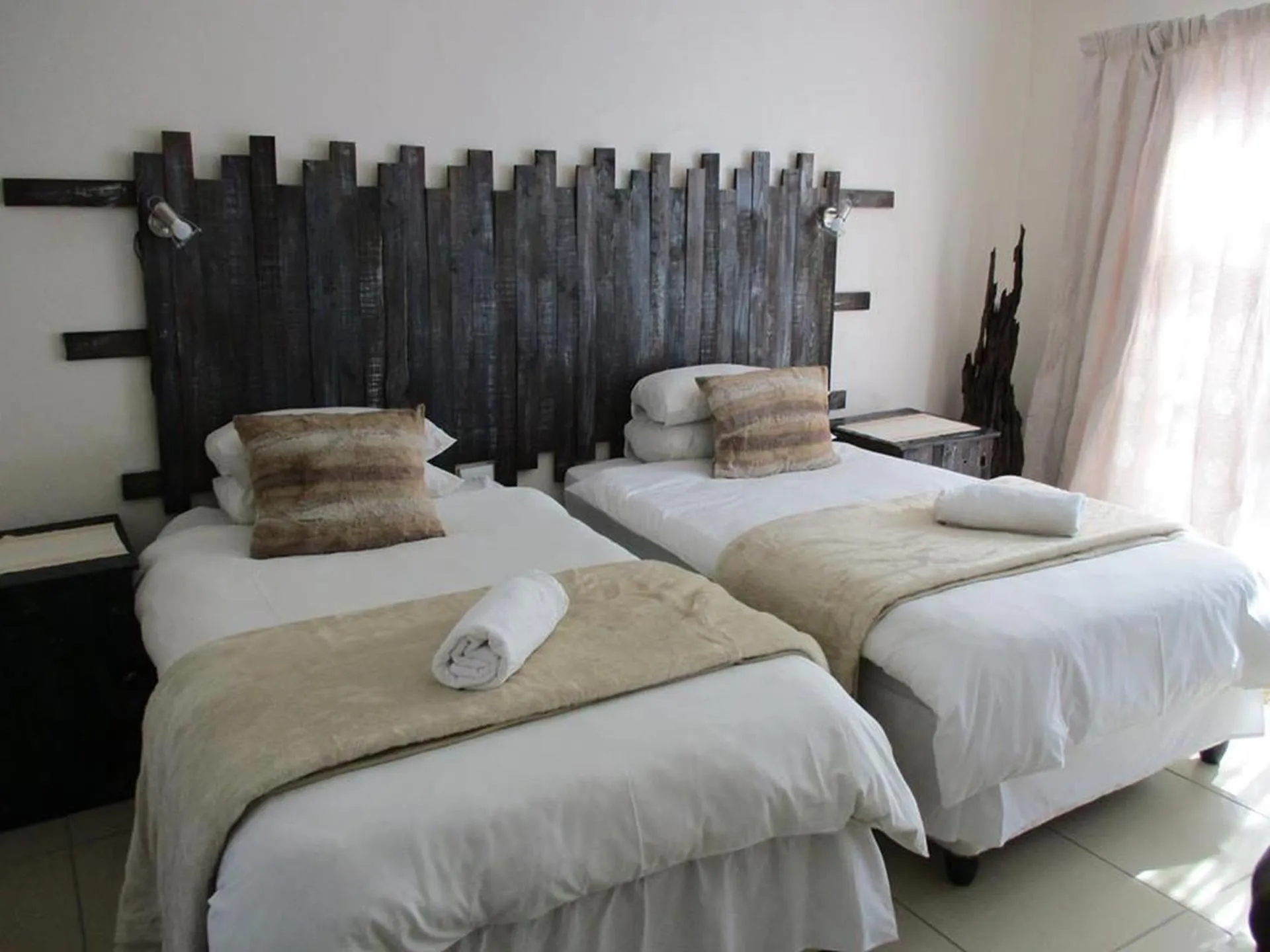 Bed in Ukarimu Guest House