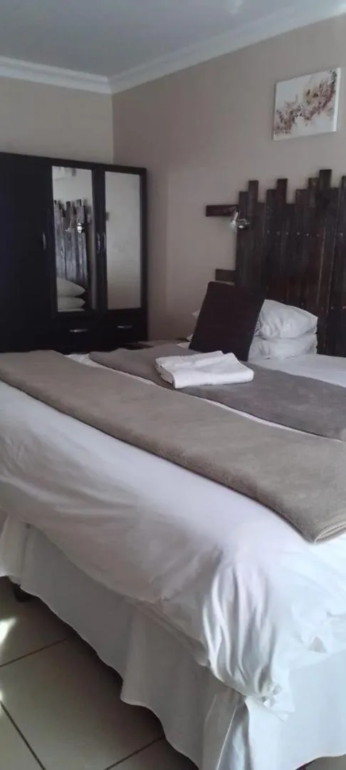 Bed in Ukarimu Guest House