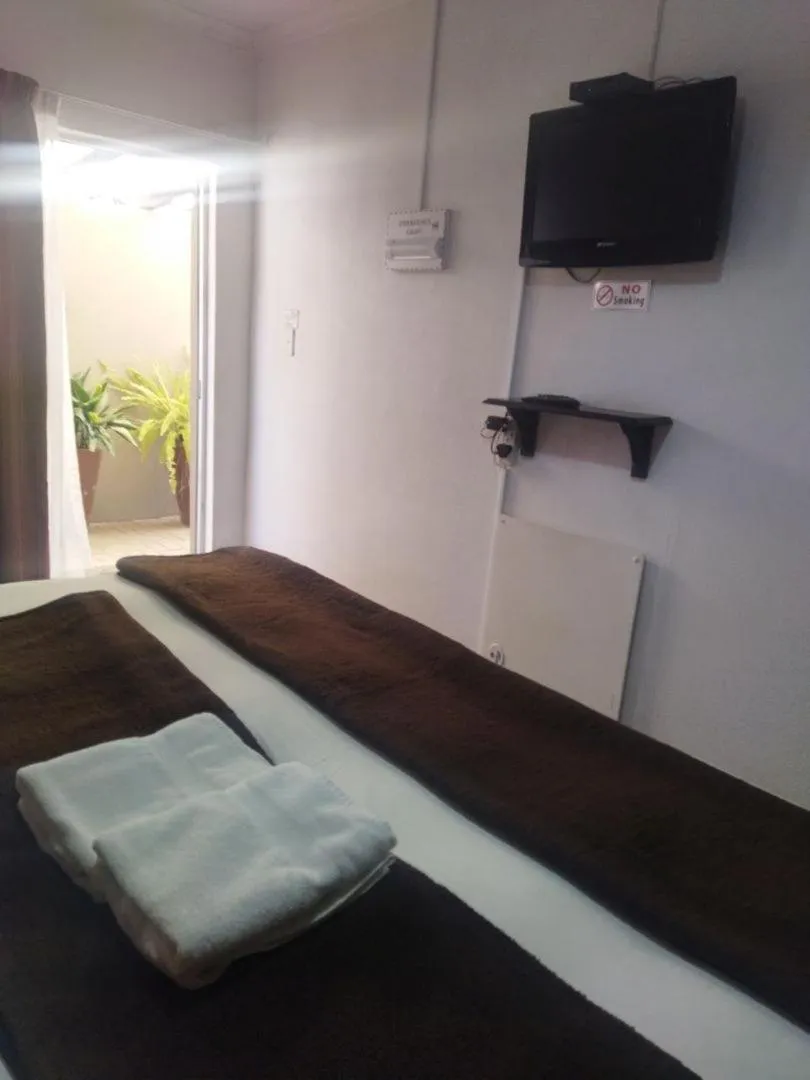 Bed in Ukarimu Guest House