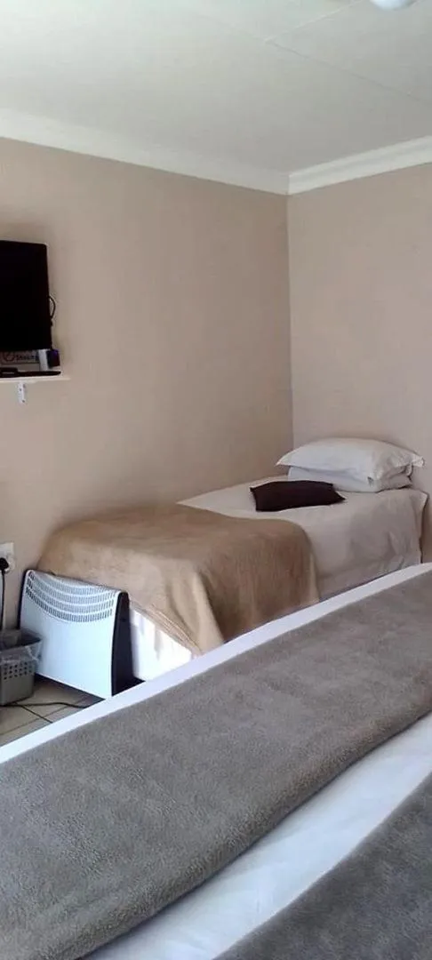 Bed in Ukarimu Guest House