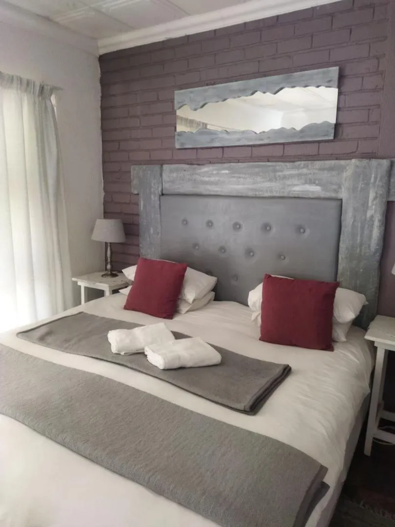 Bed in Ukarimu Guest House