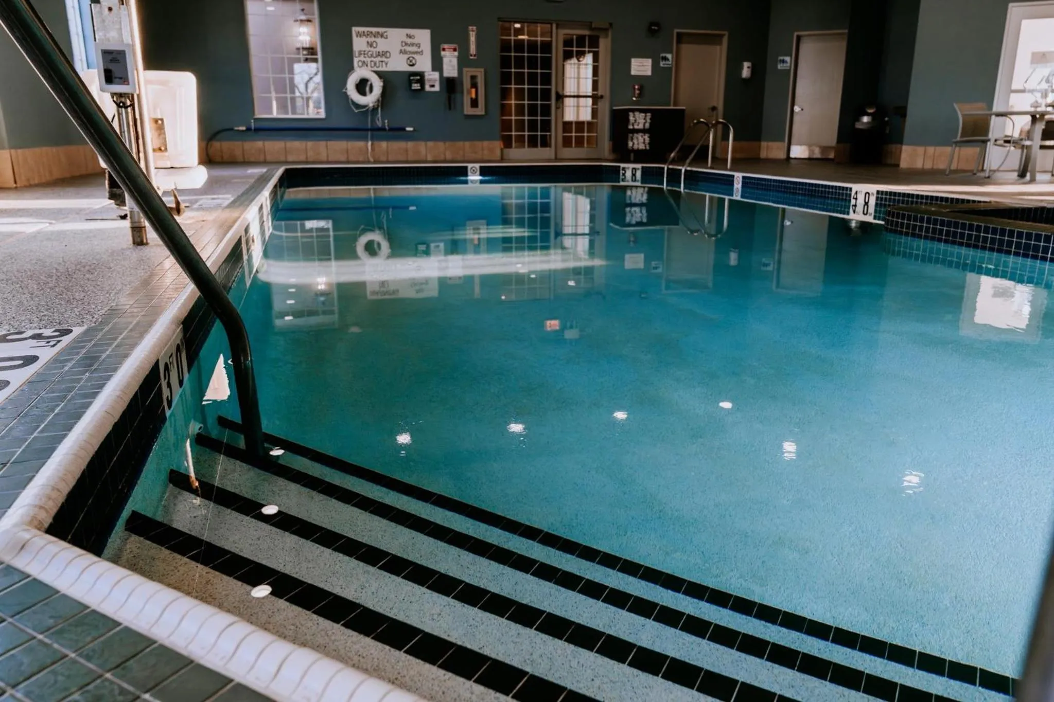 Swimming pool in Holiday Inn Express Hotel & Suites Oshkosh - State Route 41 by IHG