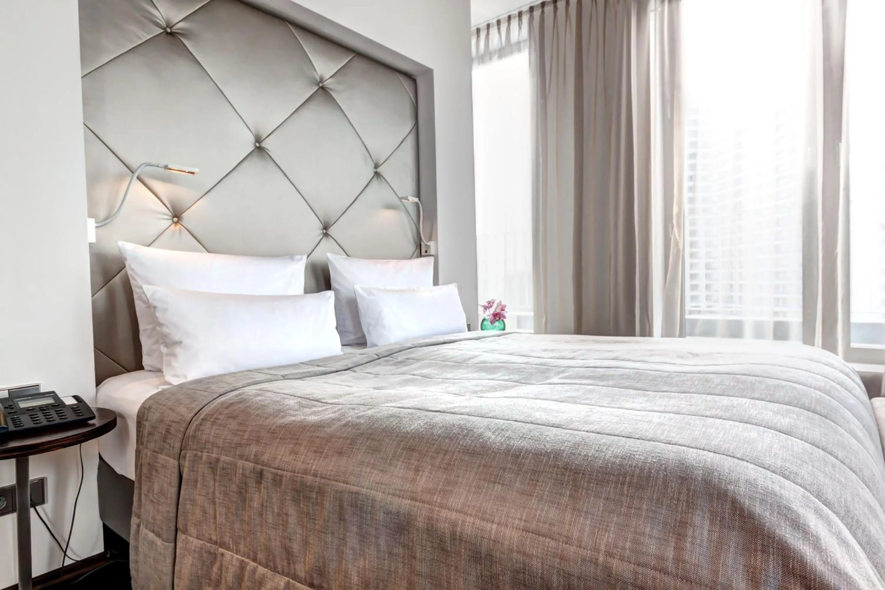 Bed in COSMO Hotel Berlin Mitte