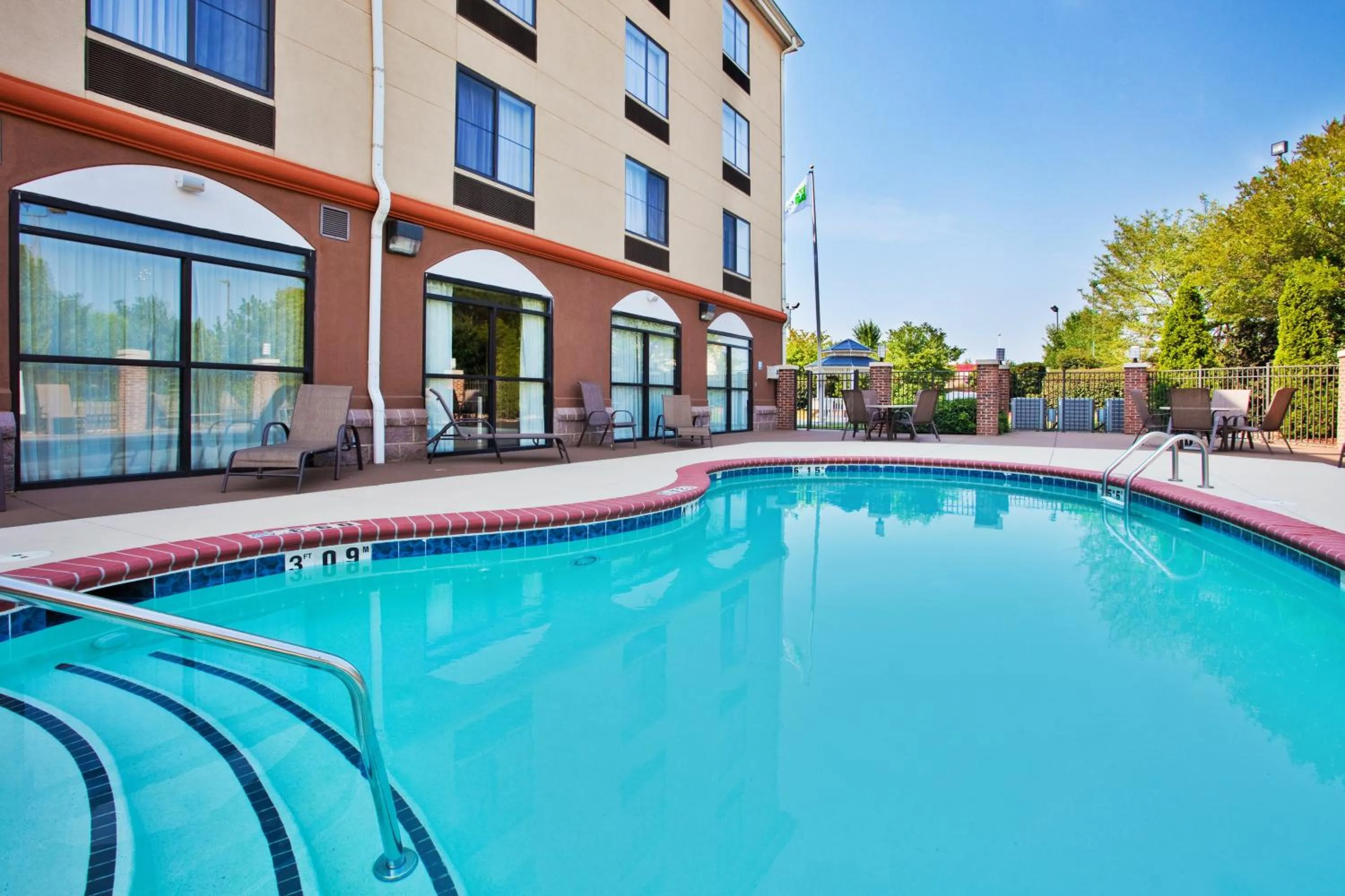 Swimming pool in Holiday Inn Express & Suites Charlotte-Concord-I-85 by IHG