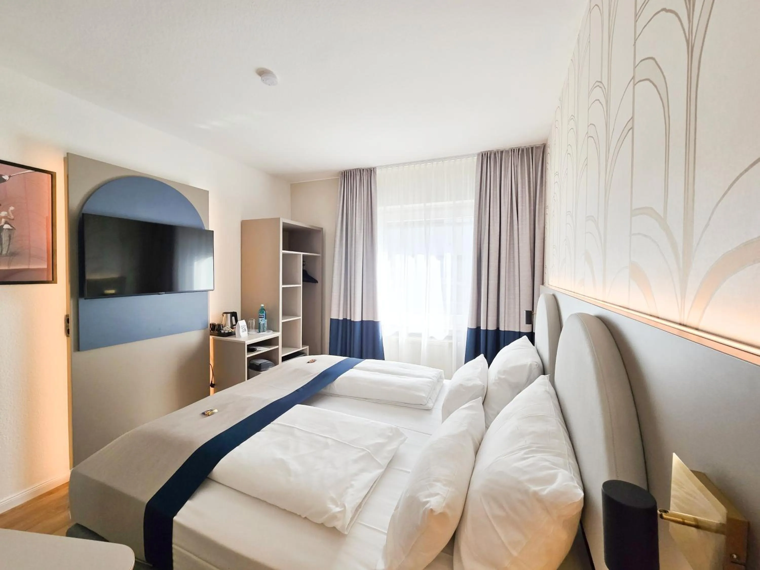 Bed in guestified LIYANA Hotel