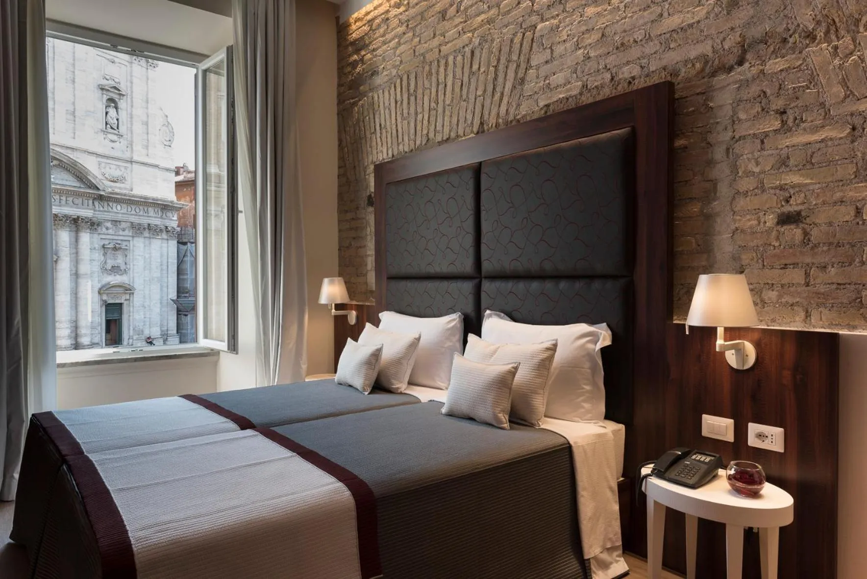 Bed in Navona Luxury Guesthouse