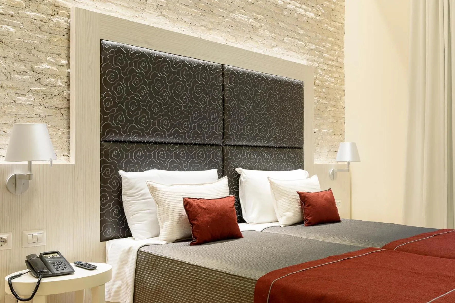 Bed in Navona Luxury Guesthouse